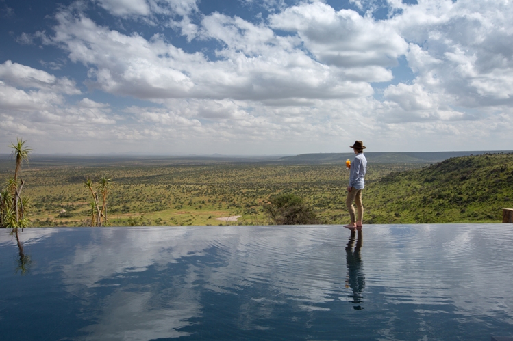 Loisaba Tented Camp infinity pool with lady and view low res