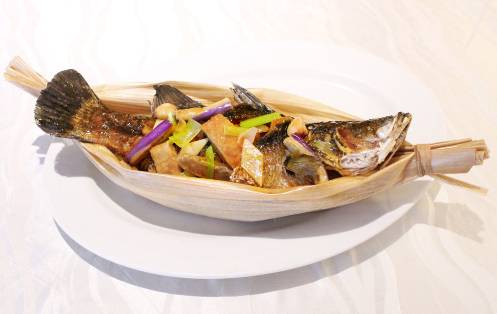 Baked Sea Bass with Whole Garlic in Opal Leaf